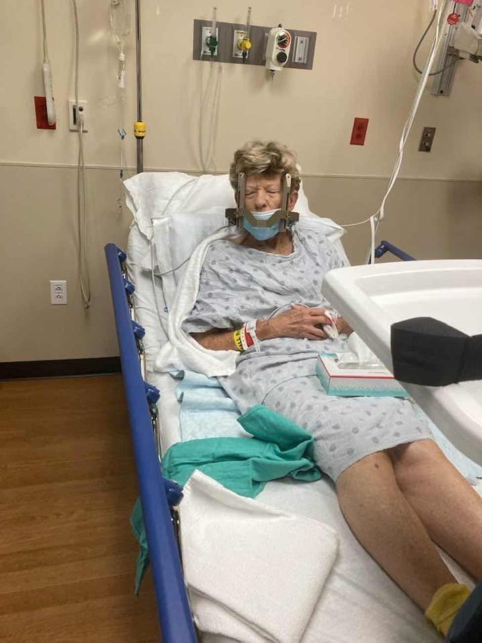 Faye Sims in a hospital bed after a gamma knife procedure